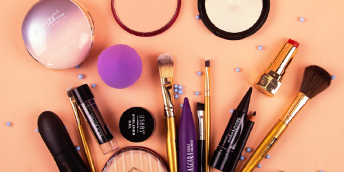 A flat lay of cosmetics brushes and make up representing the Cosmetics Direct Portal